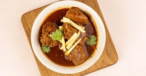 There are dishes that simply feed you, and then there are dishes that tell a story. Nihari, a regal stew with roots in the royal kitchens of Old Delhi
